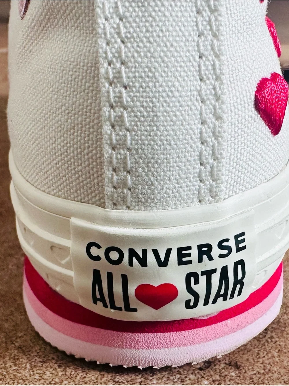 Converse White High-Top Sneakers with Pink Accents